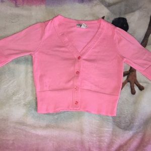 A pink child size sweater